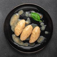 quenelles pork sauce mushroom food on a plate eating cooking appetizer meal food snack on the table copy space food background photo