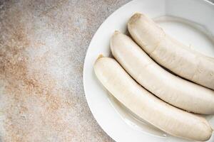 White sausage meat weisswurst bavarian sausages second course fresh Cooking appetizer meal food snack on the table copy space food background photo