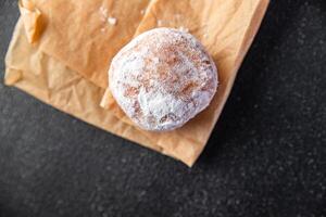 donut filled with powdered sugar chocolate filling fresh cooking appetizer meal food snack photo