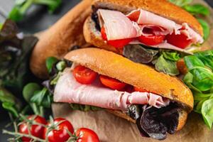 sandwich ham, tomato, green lettuce healthy eating cooking appetizer meal food snack on the table copy space food background rustic top view photo