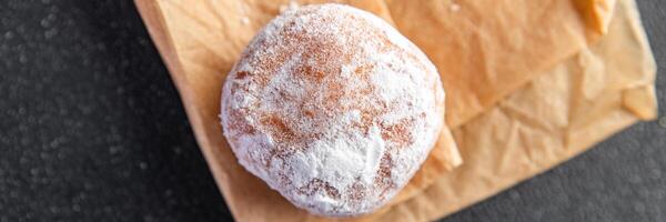 filled donut chocolate filling powdered sugar fresh meal food snack on the table copy space food photo