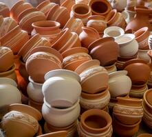 Clay jugs and pots, set of antique drinking utensils. pottery in the ceramics workshop. Pottery workshop, craft business photo