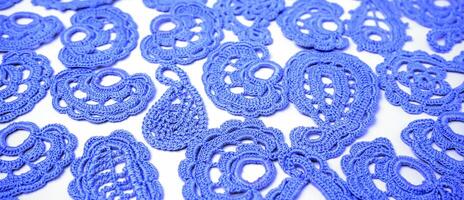 Old handmade lace pattern crocheted. Home hobby. Abstract background. Selected sharpness photo