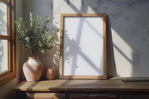 Picture Frame on Table Beside Potted Plant. photo