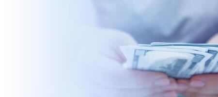 Person Holding Stack of Money, copy space. photo