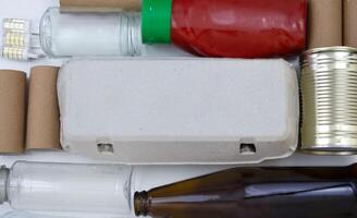 Assorted Recycling Materials Laid Out on White Background photo