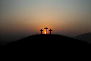 Three christian crosses on the mountain at sunrise, the crucifixion of Jesus Christ photo