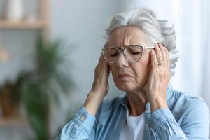 Dizziness or headache of Caucasian senior woman. photo