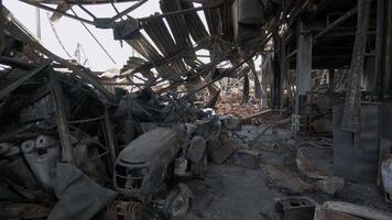 Burnt goods and equipment inside the warehouse. Destroyed logistics hub as a result of a rocket attack by Russian troops near Kyiv. War between Russia and Ukraine. video