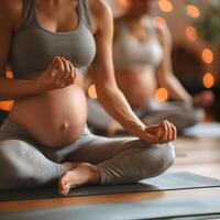 Pregnancy women group doing yoga photo