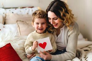 Caucasian mother and her son reading letter at bedroom photo