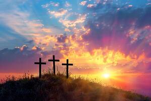 Three christian crosses on the mountain at sunrise, the crucifixion of Jesus Christ photo