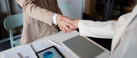 Business handshake for teamwork , Successful negotiate, Two businessman shake hand with partner to celebration partnership and business deal concept photo