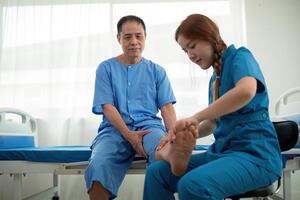 Healthcare, physiotherapist and patient with foot injury, stretching and recovery with treatment, healing or care. physical therapy or consultation photo
