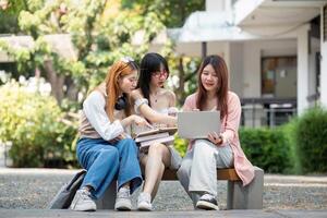 Asian young campus student enjoy learn study and reading books together. Friendship and Education concept. Campus school and university. Happiness and funny of learning in college photo