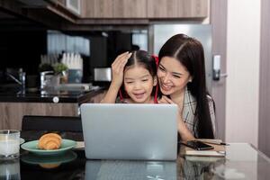 Working mom work from home office. businesswoman and cute child using laptop work freelancer workplace in home, Lifestyle family moment photo