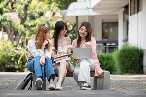 Asian young campus student enjoy learn study and reading books together. Friendship and Education concept. Campus school and university. Happiness and funny of learning in college photo