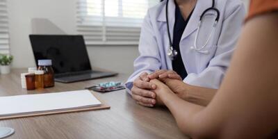 Doctor holding patient hand cheer and encourage while checking your health photo