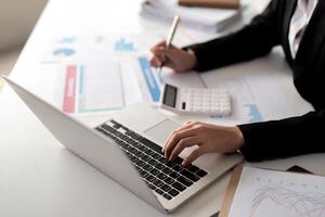 Documents, Business woman and accountant reading report for information, financial data or analysis. Paperwork, auditor check, review and bookkeeping, Calculate finance and tax in office photo
