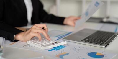 Documents, Business woman and accountant reading report for information, financial data or analysis. Paperwork, auditor check, review and bookkeeping, Calculate finance and tax in office photo