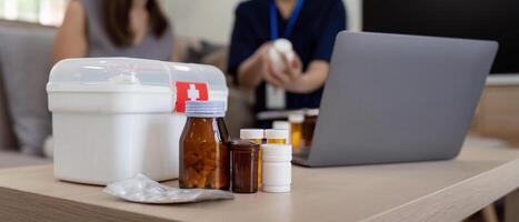 Caregiver woman hold medicine pill bottle, explain prescription to elderly old woman in living room in house photo