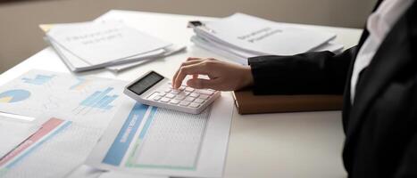 Documents, Business woman and accountant reading report for information, financial data or analysis. Paperwork, auditor check, review and bookkeeping, Calculate finance and tax in office photo