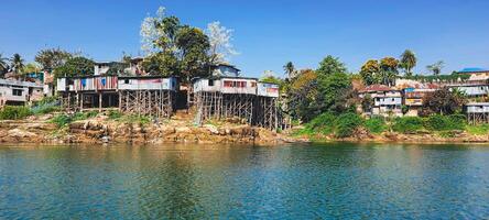 Houses on silts Rural settlements of hill tribes of Rangamati Chittagong Bangladesh photo