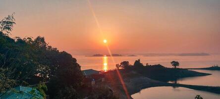 Morning sunrise of hill tracts area of Kaptai lake Rangamati photo