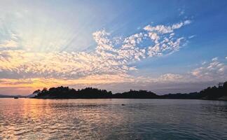 Natural cloudscape of morning sun of Kaptai Lake Rangamati Chittagong Bangladesh photo