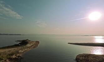 Kaptai lake foggy morning tranquil sunrise with horizon photo