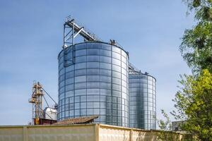 silos granary elevator on agro-industrial complex with seed cleaning and drying line for grain storage photo