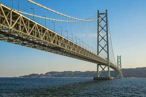 Akashi Kaikyo Bridge links Kobe on Honshu to Iwaya on Awaji island in Japan photo