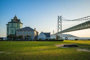 Sun Yat Sen Memorial Hall and Akashi Kaikyo bridge in Kobe, Hyogo, Japan photo