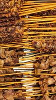 a close up of skewers of meat photo