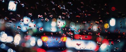 Driving in raining. Rain on car windshield or car window in rainy season and blurry traffic road in background. Rain drops on car mirror. Road in rain. Drizzle raining decreases driving visibility. photo