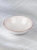 White empty deep clay plate with a spoon on a gray background. photo