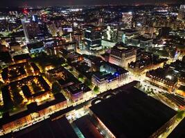 Aerial Night View of Illuminated Central Manchester City and Downtown Buildings, England United Kingdom. May 4th, 2024 photo