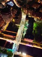 Aerial Night View of Illuminated Central Manchester City and Downtown Buildings, England United Kingdom. May 4th, 2024 photo