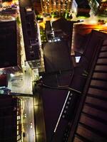 Aerial Night View of Illuminated Central Manchester City and Downtown Buildings, England United Kingdom. May 4th, 2024 photo