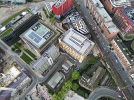 aéreo ver de mayor Manchester ciudad centrar y alto edificios durante dorado hora de puesta de sol. Inglaterra Reino Unido. mayo 5to, 2024 foto