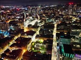 aéreo noche ver de iluminado central Manchester ciudad y céntrico edificios, Inglaterra unido Reino. mayo 4to, 2024 foto