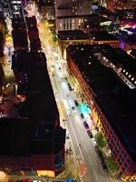 Aerial Night View of Illuminated Central Manchester City and Downtown Buildings, England United Kingdom. May 4th, 2024 photo