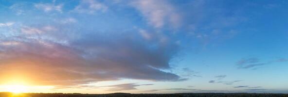 High Angle Panoramic View of Sky and Clouds During Sunrise, Luton, England UK photo