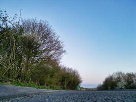 Low Angle View of British Countryside Landscape Near Oxford City, Oxfordshire, England UK During Sunrise Morning. March 23rd, 2024 photo