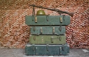 Soviet army ammunition stack of green crates with russian names of ammo type and category photo