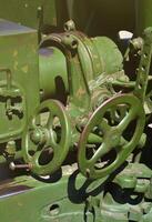 A close-up mechanism of a portable weapon of the Soviet Union of World War II, painted in a dark green color photo