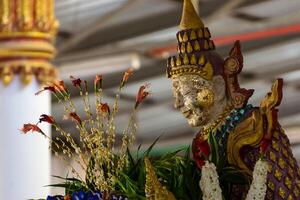 old buddha with flower photo