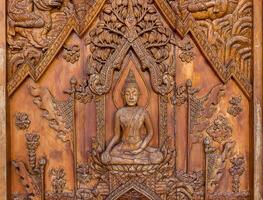Wood carving of Buddhist history photo