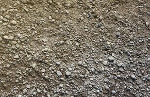 Background of shattered stony stones surface in mountain area. Texture with natural light photo