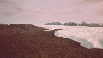 A majestic glacier surrounded by towering mountains video